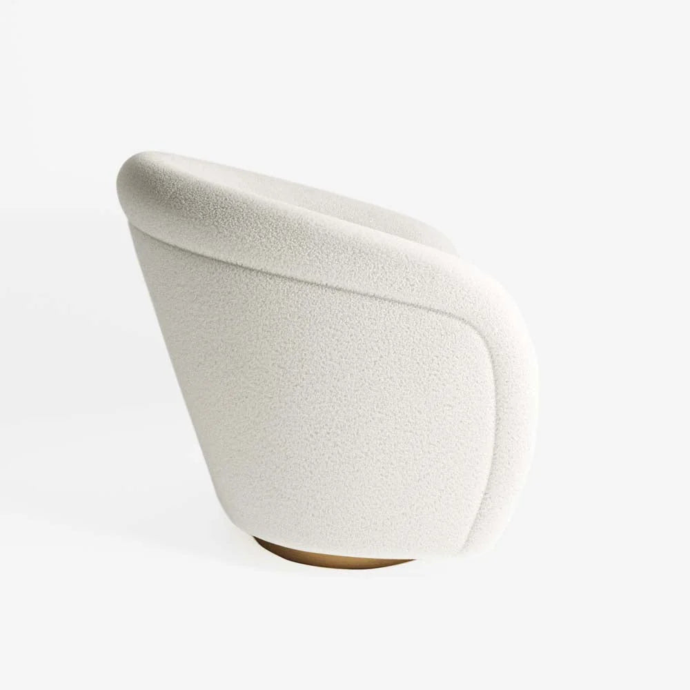 Fauteuil effet laine bouclée et laiton